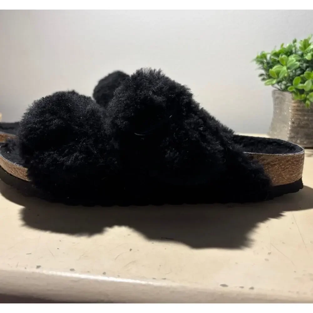 Birkenstock black shearling Sandals.